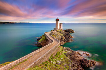 Petit Minou Lighthouse at sunset. It indicates to the boats wishing to go to Brest, the route to follow to enter the harbor. It forms an alignment with the Portzic lighthouse. It also has a red sector