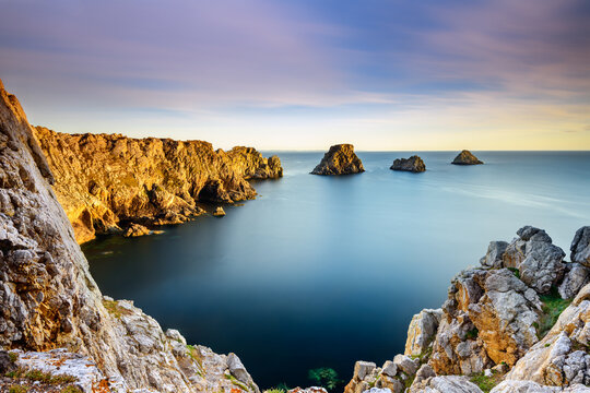 Pointe de Pen Hir with its quartzite cliff and rocky islets at sunset