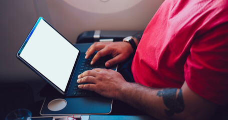 Calm passenger working on laptop in flight