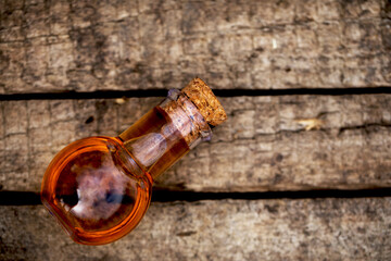 Spa oil bottle and wooden table.