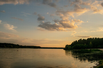 Blue sky with beautiful clouds at sunset on the river bank
