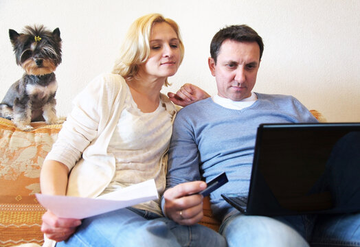 Mature couple, credit cards and Internet