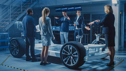 Shot of International Team of Automobile Design Engineers Introducing Futuristic Autonomous...