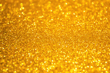 Gold background glitter christmas texture abstract light glittering stars on bokeh. glitter vintage lights background