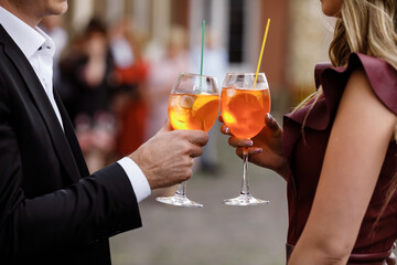 young couple drinking a cocktail.hands of two people holding cocktails. alcoholic cocktails. soft drinks