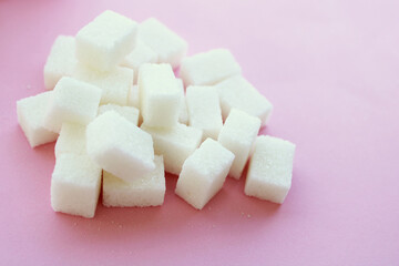 sugar cubes on light pink background