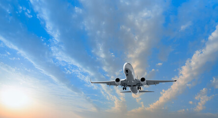 White passenger airplane in the clouds - Travel by air transport