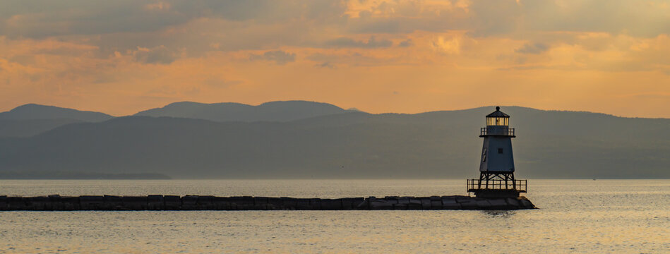 banner photo of the lighthouse at sunset on the waterfront of Lake Champlain in Burlington, Vermont
