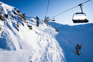 Fototapeta na wymiar Gondola lift on the snowy slopes of the Brenta Dolomites - Alps