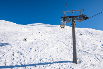 Fototapeta na wymiar Gondola lift on the snowy slopes of the Brenta Dolomites - Alps