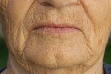 Close up image of mouth of senior woman.