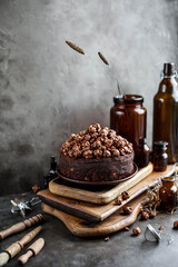 Very chocolate cake on wooden boards. Dark photography.
