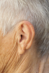 Close up image of ear of senior woman.