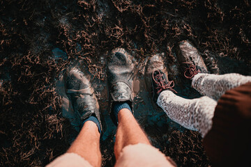 feet in the mud, top view
