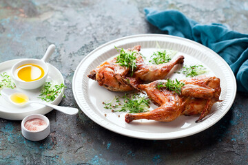 Halves grilled roast chicken and micro greens, selective focus