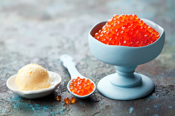 Salmon roe red caviar and butter, selective focus