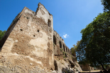 The castle with  Lion fountain by Bernini in Ancient Monterano,with the Lion on top the wall, represented in the act of shaking the rock with a paw to make the water emanate.