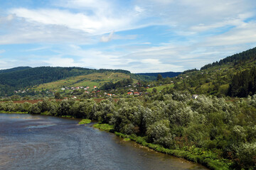 summer landscape with mountains and river