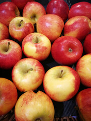 Close-up of red apples in basket for sale