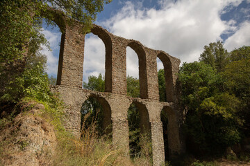 The 17th century aqueduct of Monterano Natural Reserve.A ghost medieval city in the country of...