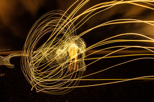 Long Exposure Shot Of A Man Surrounded By Light Circles