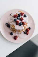 Stack of Small pancakes in syrup