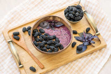 smoothies bowl with banana, ground flax and mulberry