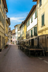 Fototapeta na wymiar Pedestrian street in the historic city of Montelupo Fiorentino, Tuscany region, Florence province