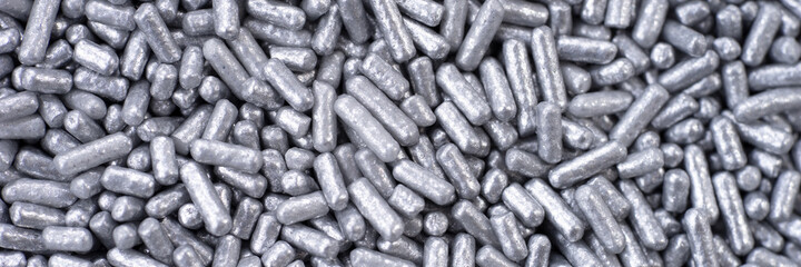 Silver eatable sugar pearls for food decoration. Panoramic image