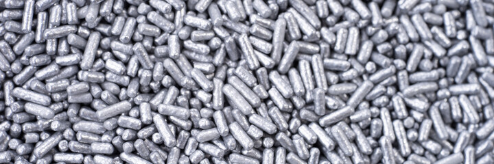 Silver eatable sugar pearls for food decoration. Panoramic image