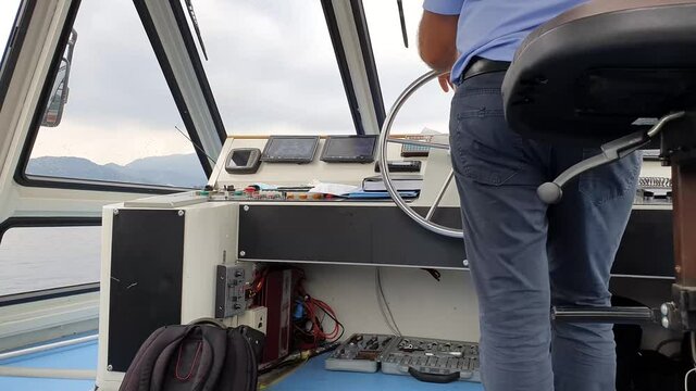 boat cabin with rudder and helmsman