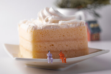 Coconut cake with white cream, smooth and fine texture on white background