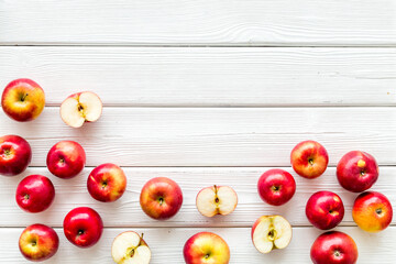 Set of whole and cut apples - above view, space for text