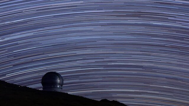 Star trails over the astronomical observatory seen from the Roque de Los Muchachos peak. Caldera de Taburiente National Park, La Palma, Canary Islands, Spain, Europe.