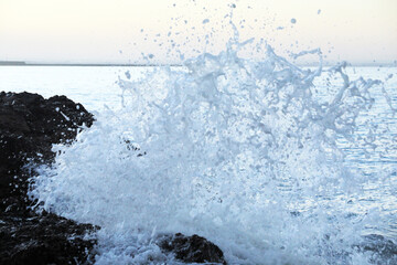 Splashing seawater against the rocks