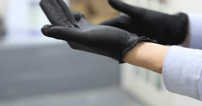 putting on a latex glove