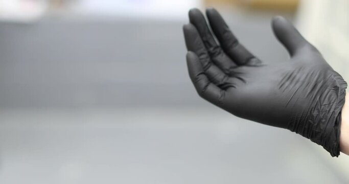putting on a latex glove