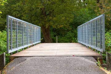 A walking path bridge in a park