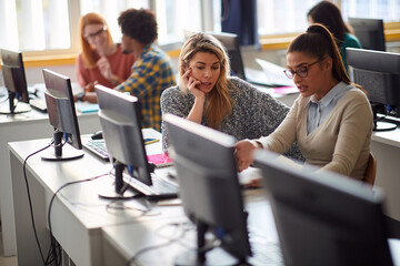 Girls in desk working together
