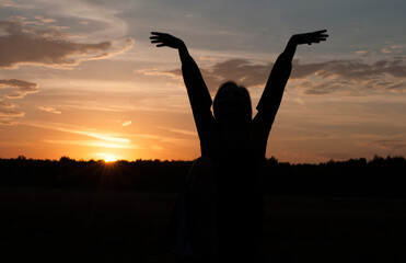 Fototapeta premium Silhouette of a girl. Sunrise