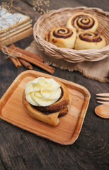 Cinnamon  rolls on a plate from nature on the old table