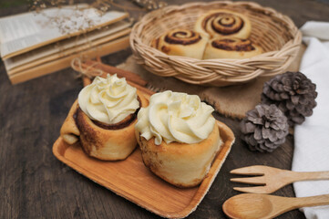 Cinnamon  rolls on a plate from nature on the old table