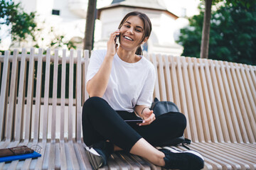 Positive female talking on mobile phone