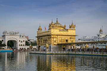 Fototapeta premium Evening view of the Golden temple in Amritsar, India with beautiful blue sky.