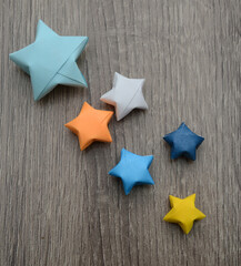 Origami lucky stars on wooden