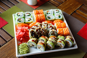 Sushi set of different types on a plate. Sushi in the sushi bar. Top view.