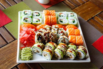 Sushi set of different types on a plate. Sushi in the sushi bar. Top view.