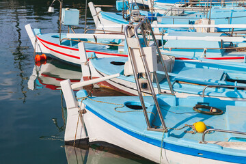 Traditional Greek white blue wooden fishing boats