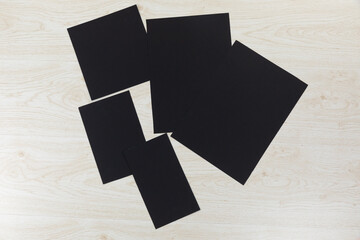 Black sheet of papers on wood table