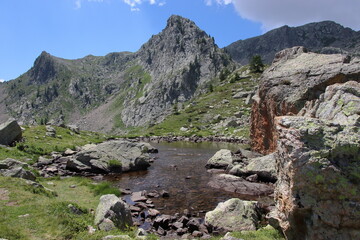 Jaw-droppingly beautiful mountains and lakes in Sant'Anna di Vinadio on a partly cloudy day.